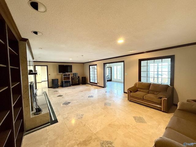 living room with a textured ceiling and crown molding