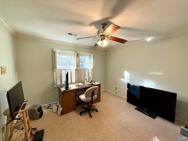 carpeted home office featuring a textured ceiling, ceiling fan, and crown molding