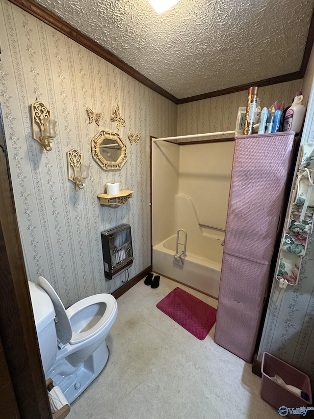 bathroom with wallpapered walls, toilet, heating unit, crown molding, and a textured ceiling