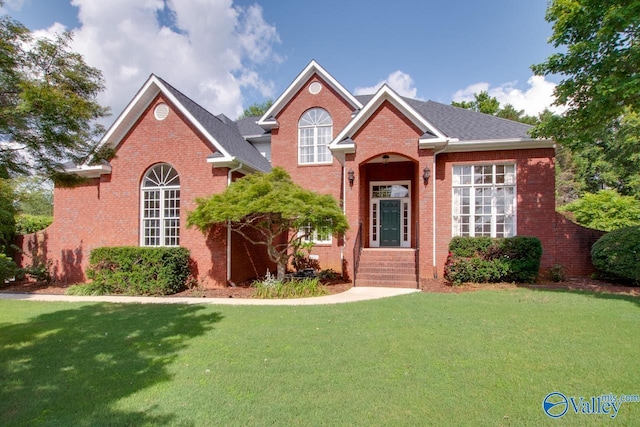 102 Twin Island Cir, Madison, AL 35758 - traditional-style home featuring a front lawn and brick siding
