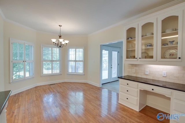 102 Twin Island Cir, Madison, AL 35758 - unfurnished dining area with a chandelier, light wood-style flooring, ornamental molding, an office area, and baseboards