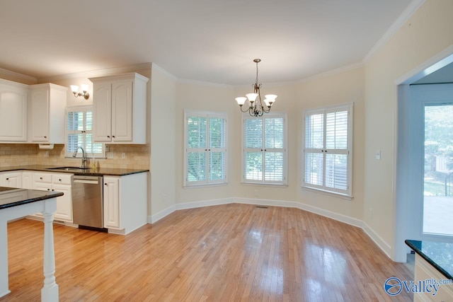 102 Twin Island Cir, Madison, AL 35758 - kitchen featuring stainless steel dishwasher, a chandelier, dark countertops, light wood-type flooring, and tasteful backsplash