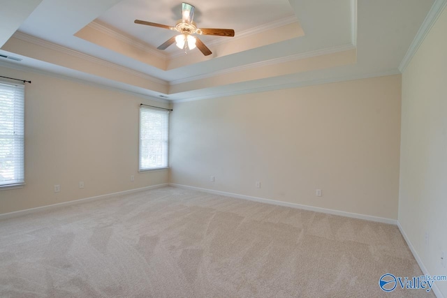102 Twin Island Cir, Madison, AL 35758 - unfurnished room with a raised ceiling, a ceiling fan, light carpet, crown molding, and baseboards