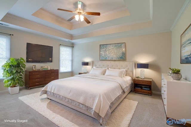 102 Twin Island Cir, Madison, AL 35758 - bedroom featuring light colored carpet, multiple windows, a tray ceiling, and ornamental molding
