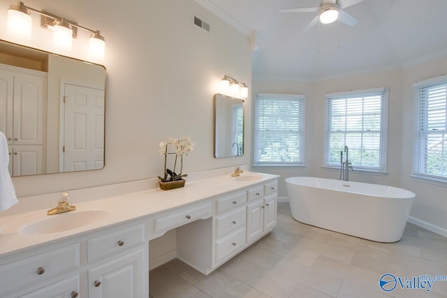 102 Twin Island Cir, Madison, AL 35758 - bathroom with double vanity, a freestanding bath, crown molding, ceiling fan, and tile patterned flooring