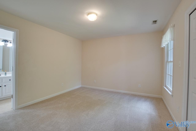 102 Twin Island Cir, Madison, AL 35758 - spare room with light colored carpet and baseboards