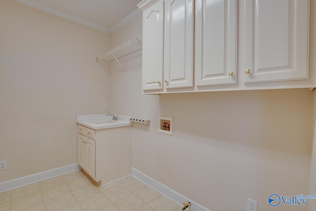 102 Twin Island Cir, Madison, AL 35758 - laundry room with washer hookup, cabinet space, ornamental molding, baseboards, and light tile patterned flooring