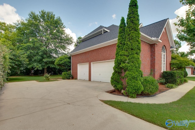 102 Twin Island Cir, Madison, AL 35758 - view of property exterior featuring concrete driveway, brick siding, and a shingled roof