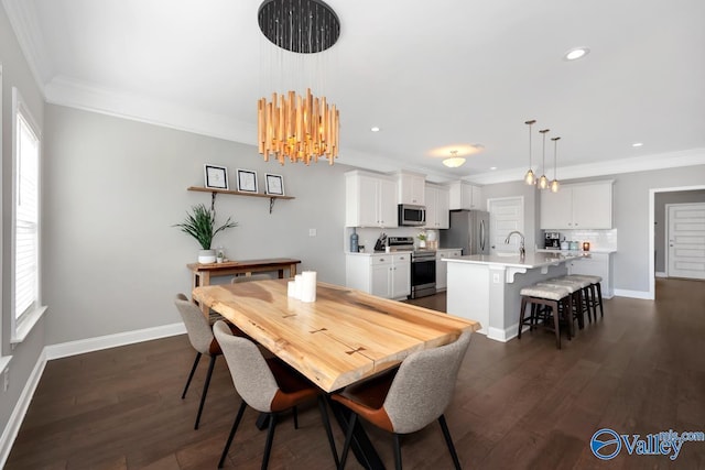 dining room with baseboards, ornamental molding, and dark wood-style flooring