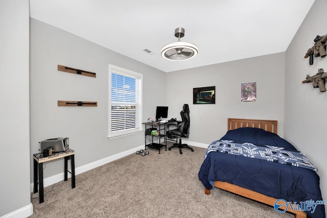 bedroom with carpet, visible vents, and baseboards