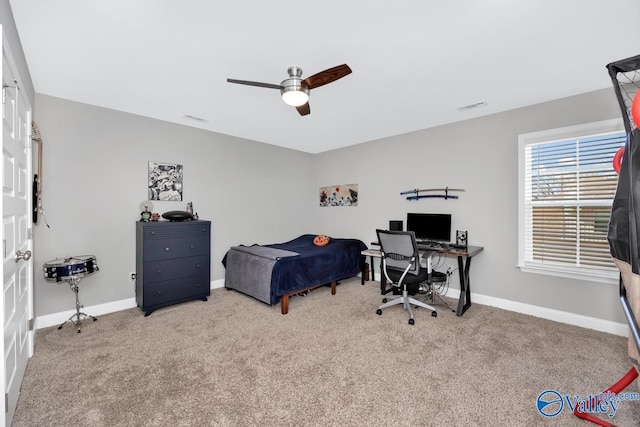 bedroom with light carpet, a ceiling fan, visible vents, and baseboards