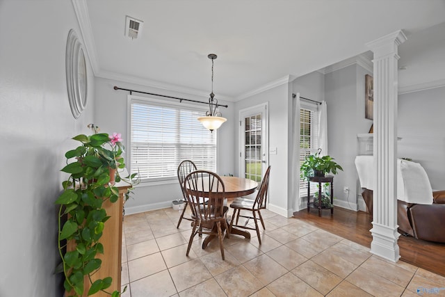 dining room with light tile patterned floors, ornamental molding, decorative columns, and visible vents