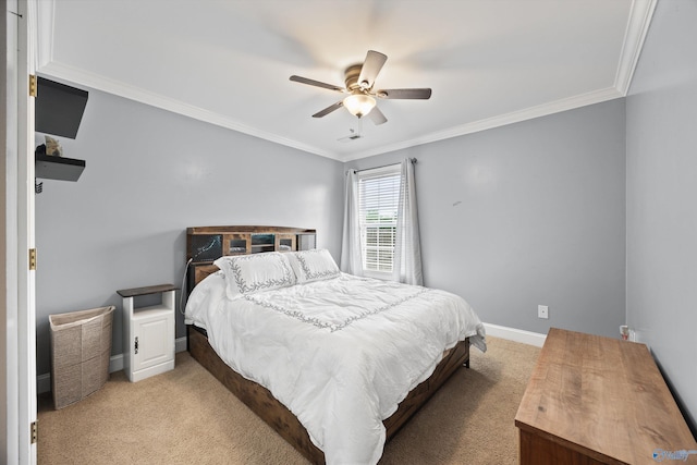 bedroom featuring carpet flooring, baseboards, ornamental molding, and ceiling fan