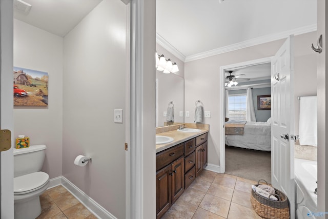ensuite bathroom featuring crown molding, double vanity, toilet, a sink, and ensuite bath