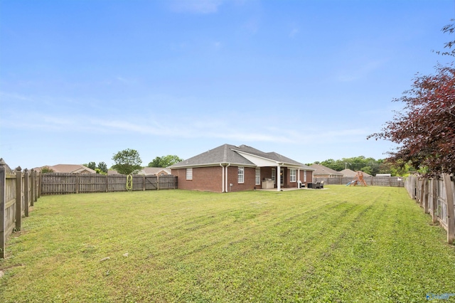 view of yard featuring a patio and a fenced backyard