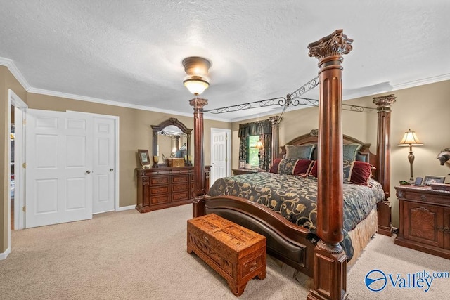 bedroom featuring crown molding, a textured ceiling, light carpet, and decorative columns
