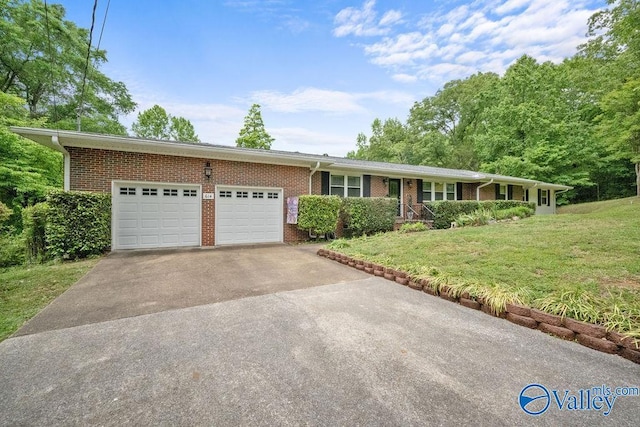 ranch-style house with a front lawn, brick siding, driveway, and a garage