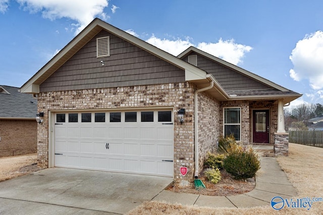 ranch-style home with a garage, brick siding, and driveway