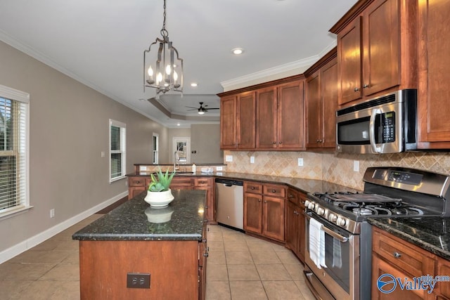 kitchen with crown molding, stainless steel appliances, decorative backsplash, and light tile patterned flooring