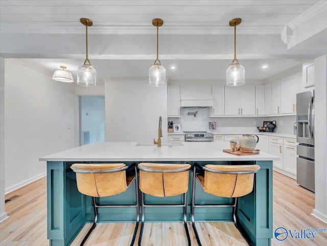 1901 Governors Dr SE, Huntsville, AL 35801 - kitchen featuring stainless steel appliances, crown molding, white cabinets, light countertops, and backsplash