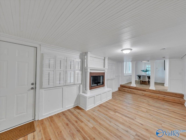 1901 Governors Dr SE, Huntsville, AL 35801 - unfurnished living room featuring wood ceiling, light wood finished floors, a glass covered fireplace, and crown molding