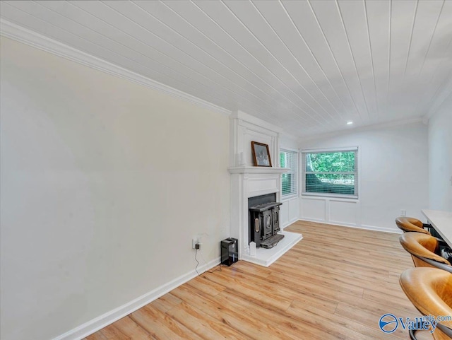 1901 Governors Dr SE, Huntsville, AL 35801 - living room featuring crown molding, light wood-style flooring, a wood stove, and wood ceiling