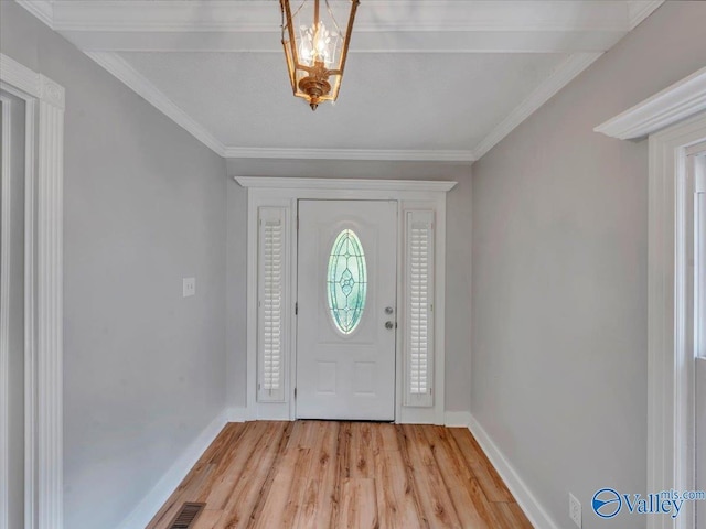 1901 Governors Dr SE, Huntsville, AL 35801 - entryway with light wood finished floors, crown molding, and a chandelier