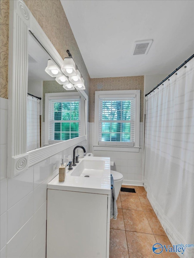 1901 Governors Dr SE, Huntsville, AL 35801 - full bathroom with vanity, tile walls, tile patterned floors, and a shower with shower curtain