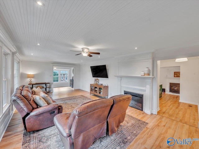 1901 Governors Dr SE, Huntsville, AL 35801 - living room featuring a glass covered fireplace, light wood-style flooring, ceiling fan, recessed lighting, and crown molding