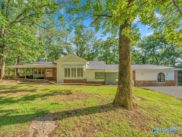 1901 Governors Dr SE, Huntsville, AL 35801 - view of front of home with a front yard and brick siding