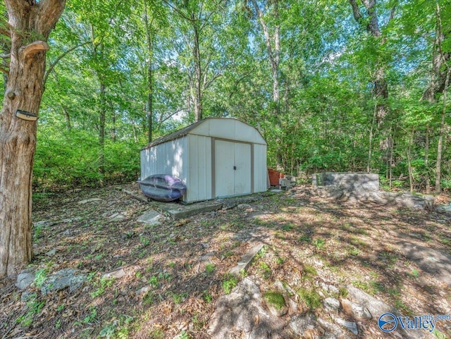 1901 Governors Dr SE, Huntsville, AL 35801 - view of yard with a storage shed and a forest view