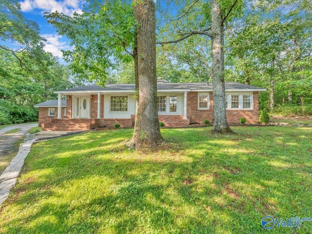 1901 Governors Dr SE, Huntsville, AL 35801 - ranch-style home featuring brick siding, a front yard, and driveway