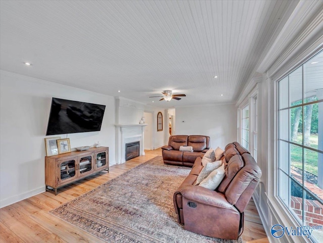 1901 Governors Dr SE, Huntsville, AL 35801 - living room with a glass covered fireplace, light wood-style floors, crown molding, recessed lighting, and ceiling fan