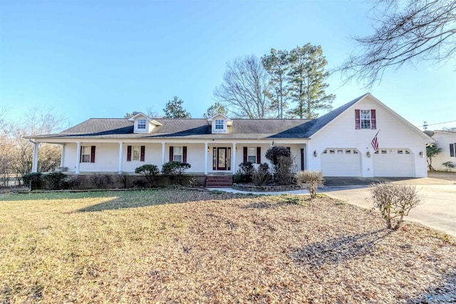 view of front of home with covered porch, concrete driveway, and a front yard