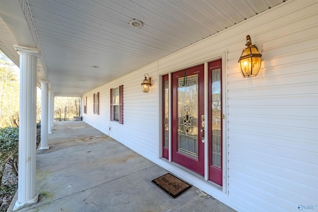 view of exterior entry with covered porch