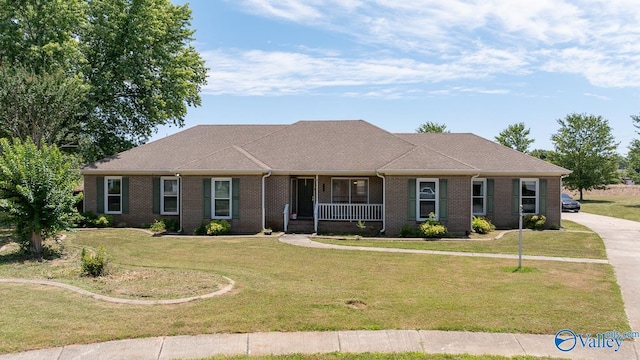 single story home featuring a front yard and covered porch