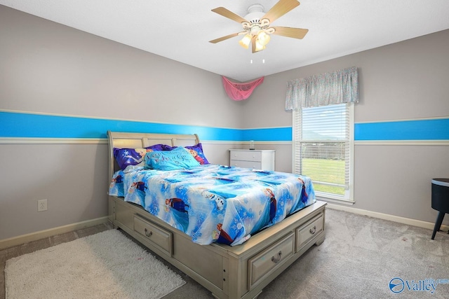 carpeted bedroom with baseboards and a ceiling fan