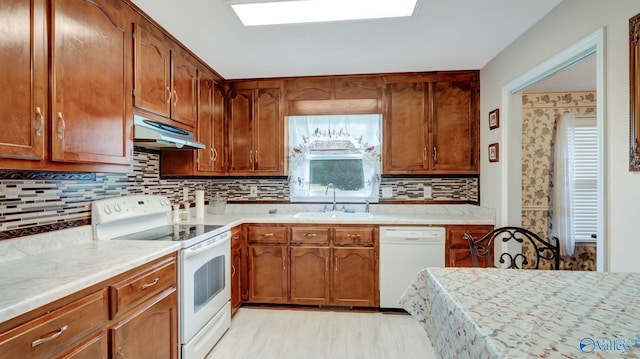 565 Joe Quick Rd, Hazel Green, AL 35750 - kitchen featuring white appliances, a sink, under cabinet range hood, and light countertops