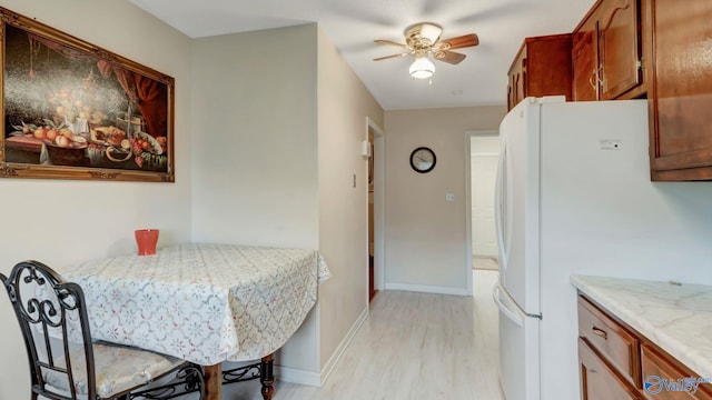 565 Joe Quick Rd, Hazel Green, AL 35750 - dining area featuring light wood-style floors, a ceiling fan, and baseboards