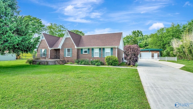 565 Joe Quick Rd, Hazel Green, AL 35750 - view of front of home featuring brick siding, a front yard, an outdoor structure, a garage, and concrete driveway