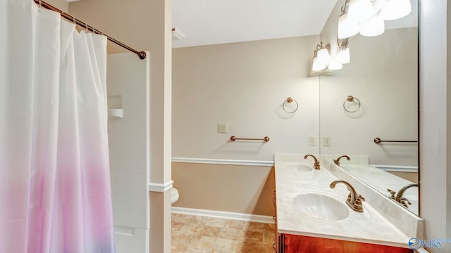 565 Joe Quick Rd, Hazel Green, AL 35750 - full bath with toilet, double vanity, and baseboards
