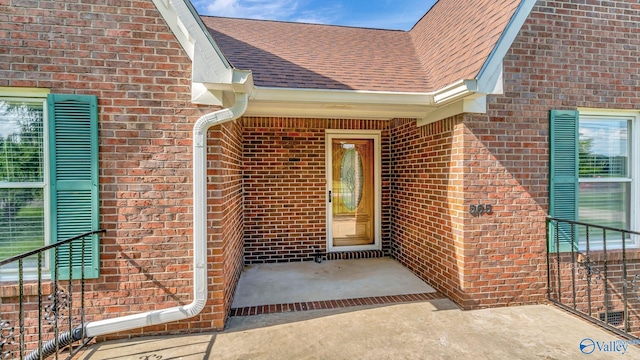 565 Joe Quick Rd, Hazel Green, AL 35750 - doorway to property with brick siding and roof with shingles