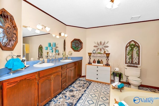 bathroom with ornamental molding, a bathtub, vanity, and toilet