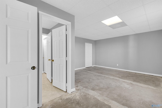 empty room featuring a paneled ceiling