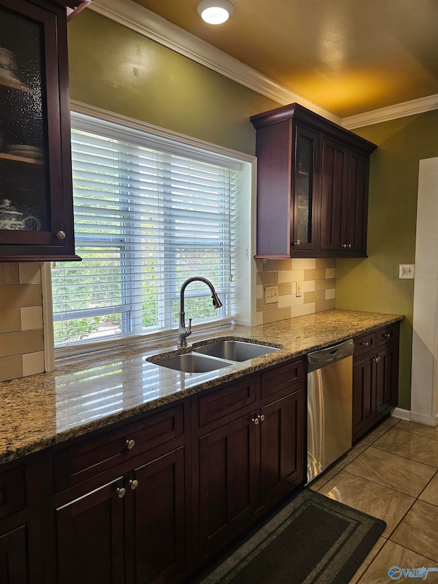 kitchen with sink, stainless steel dishwasher, backsplash, crown molding, and a healthy amount of sunlight