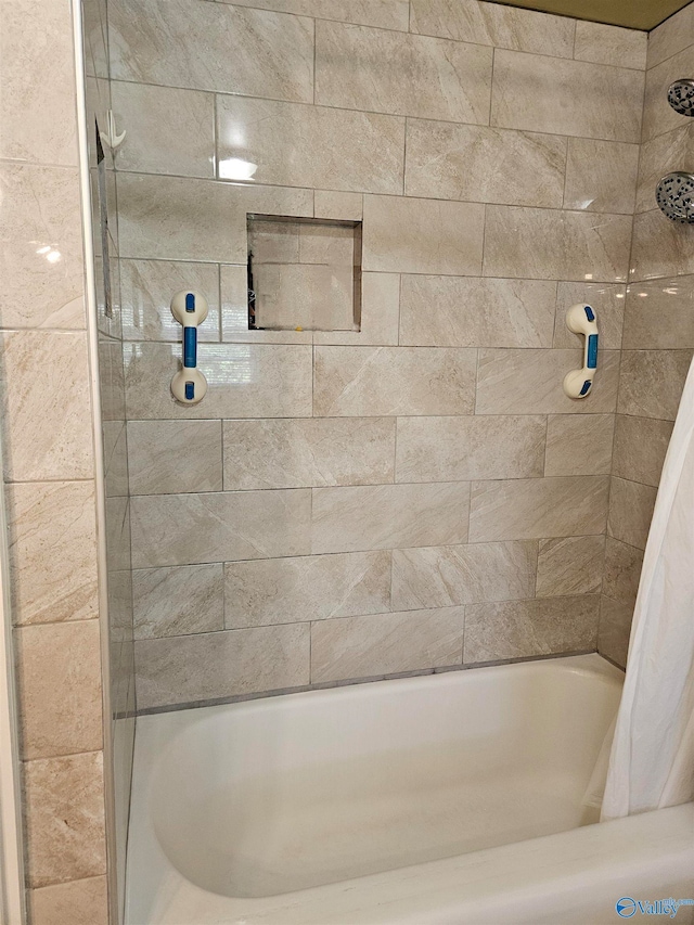 bathroom featuring shower / tub combo with curtain