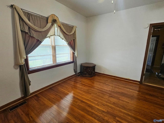 unfurnished room featuring wood-type flooring and ceiling fan