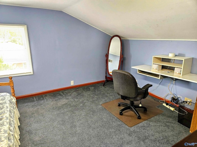 carpeted office space featuring lofted ceiling