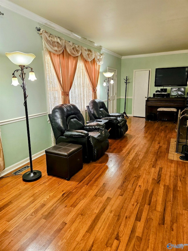 living room featuring ornamental molding and wood-type flooring