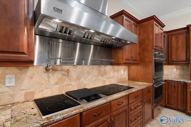 kitchen featuring exhaust hood, decorative backsplash, and crown molding